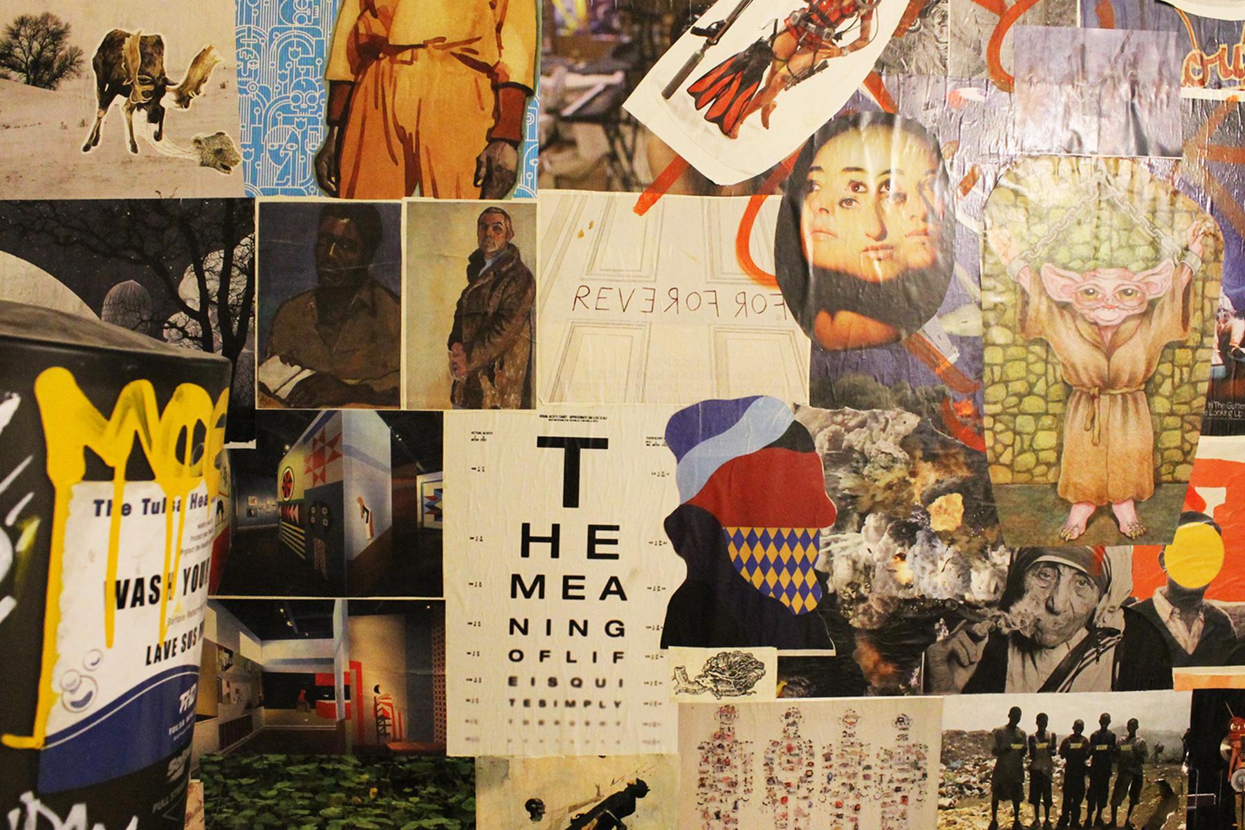 A colorful collage wall inside PieHole Pizzeria